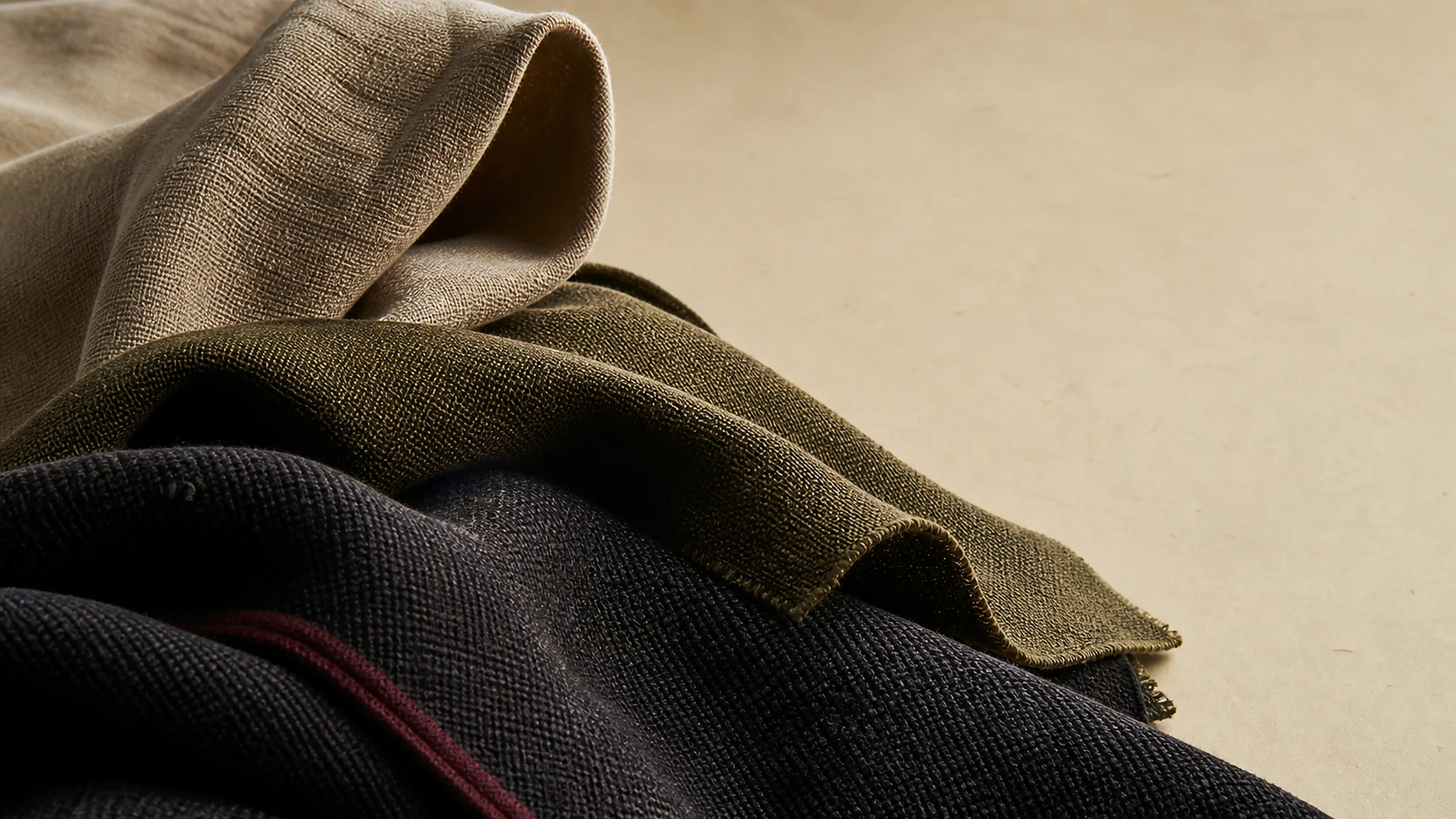Woven textile detail on an archival paper ground