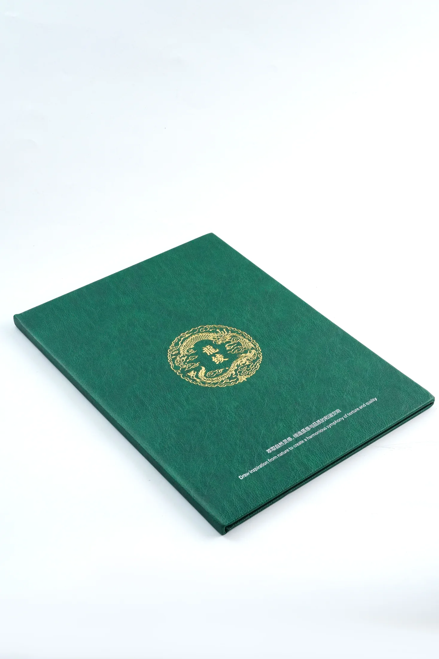 Closed green LongLing viscose lining sample book with gold logo
